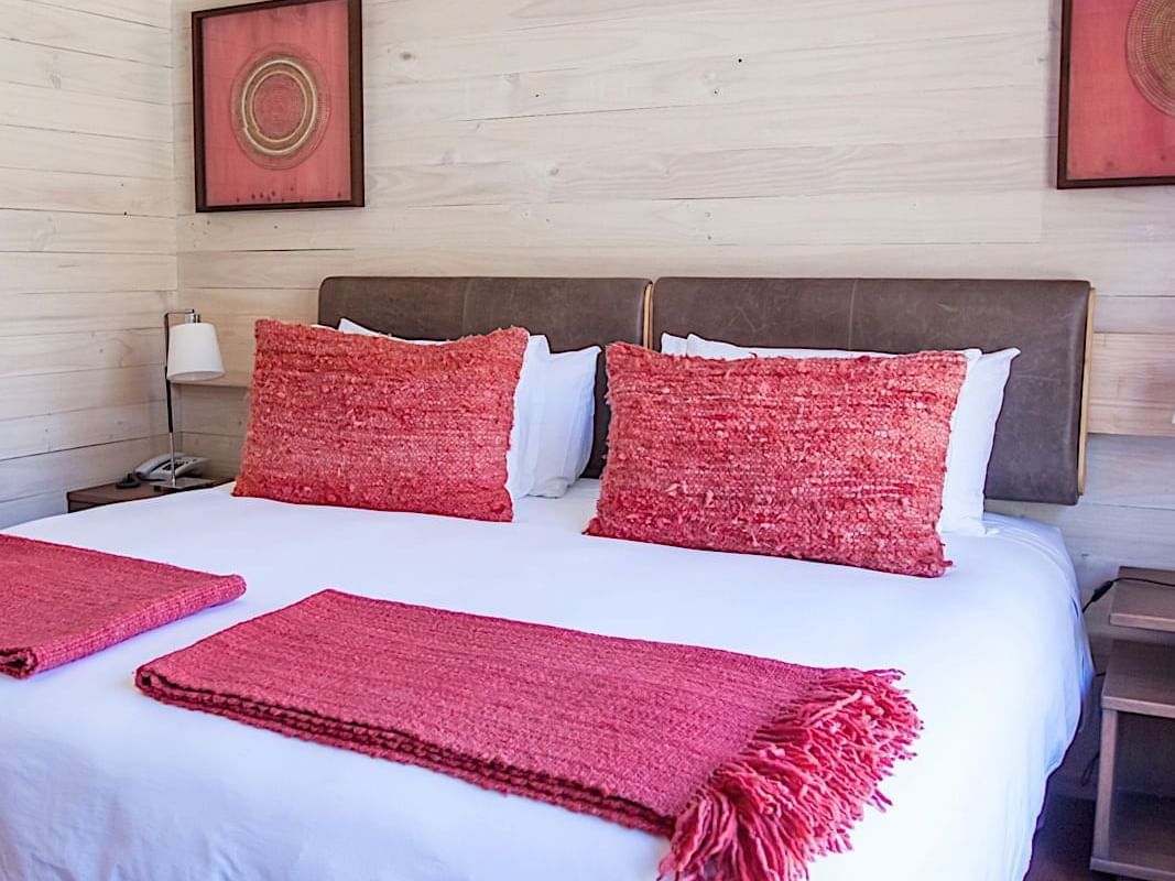 deluxe room bedroom with King Bed at NOI Puma Lodge Hotel