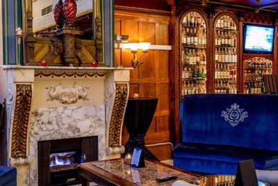 Lounge area by the fireplace in the bar at Horton Grand Hotel