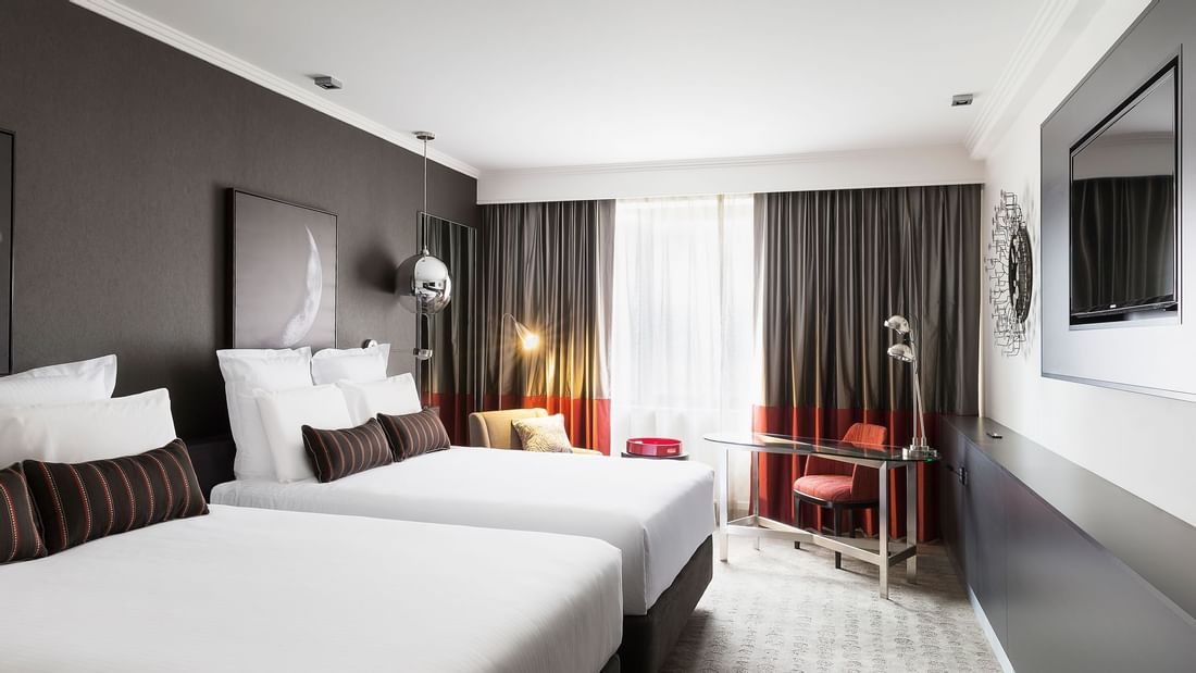 Queen beds and work area in Classic Room at Pullman Albert Park