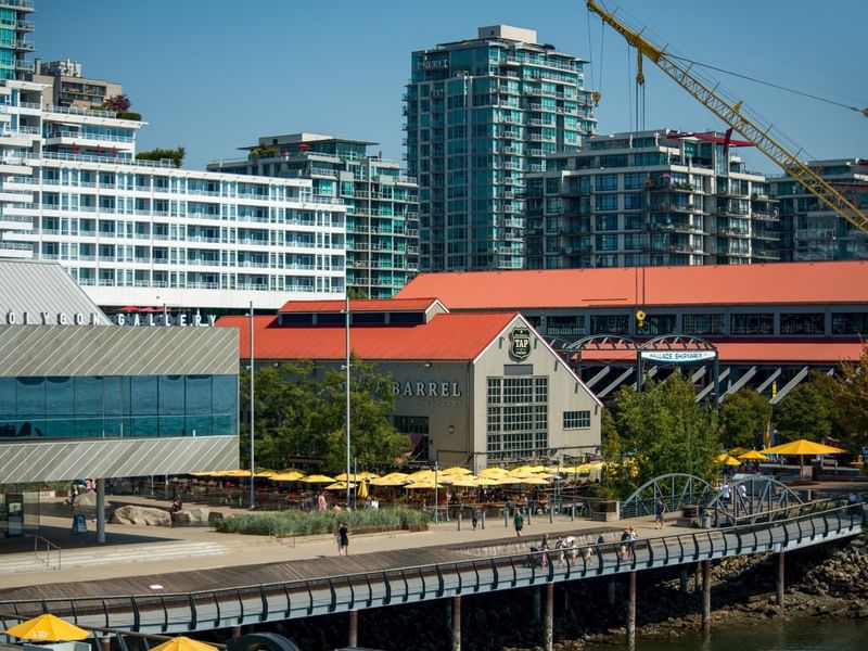 Yellow umbrellas over picnic tables at the Shipyards