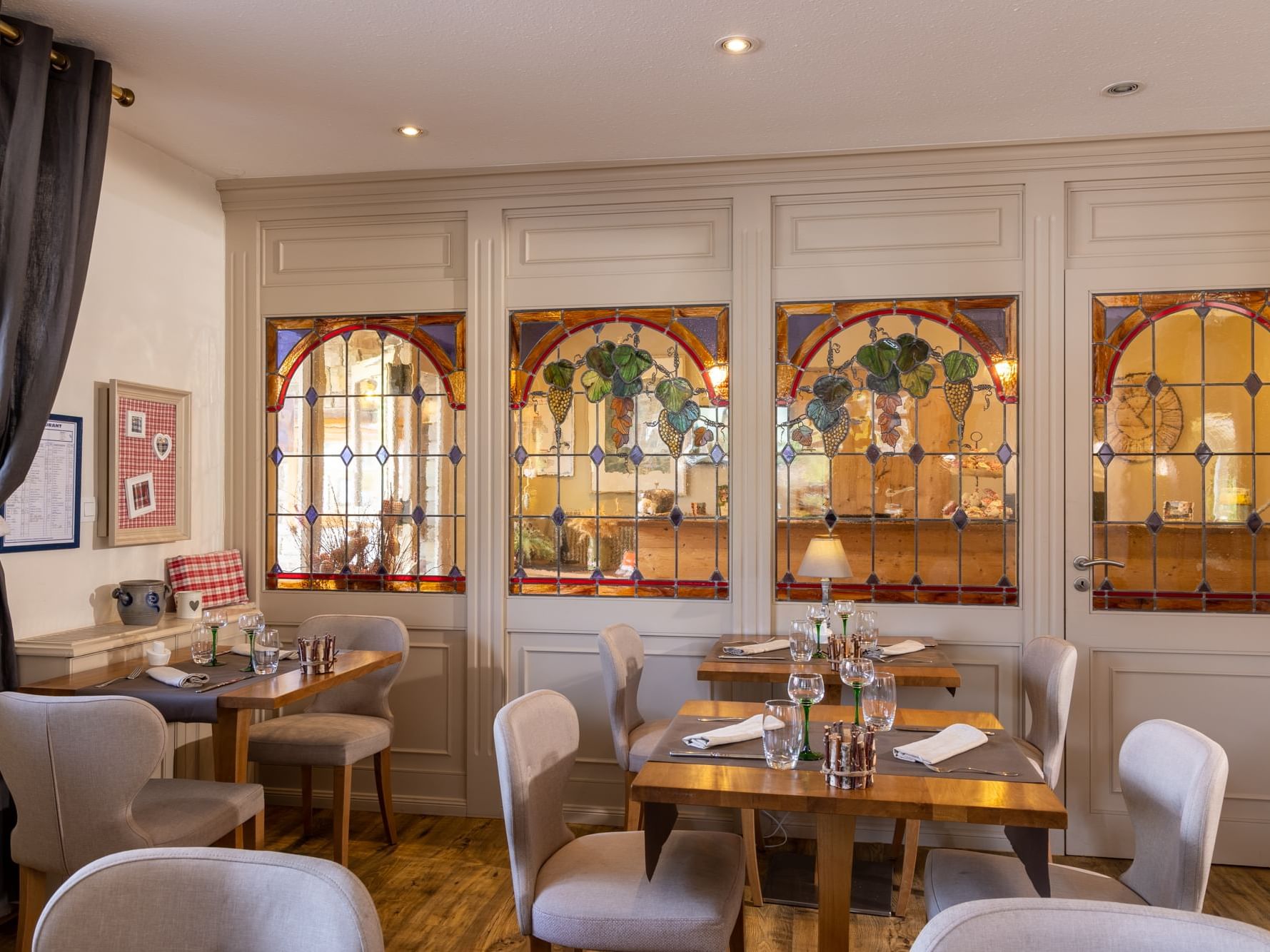 Restaurant interior with window paintings at Originals Hotel