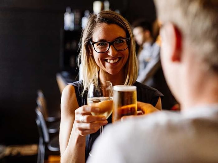 Couple enjoying drinks in Hazards Bar near Freycinet Lodge