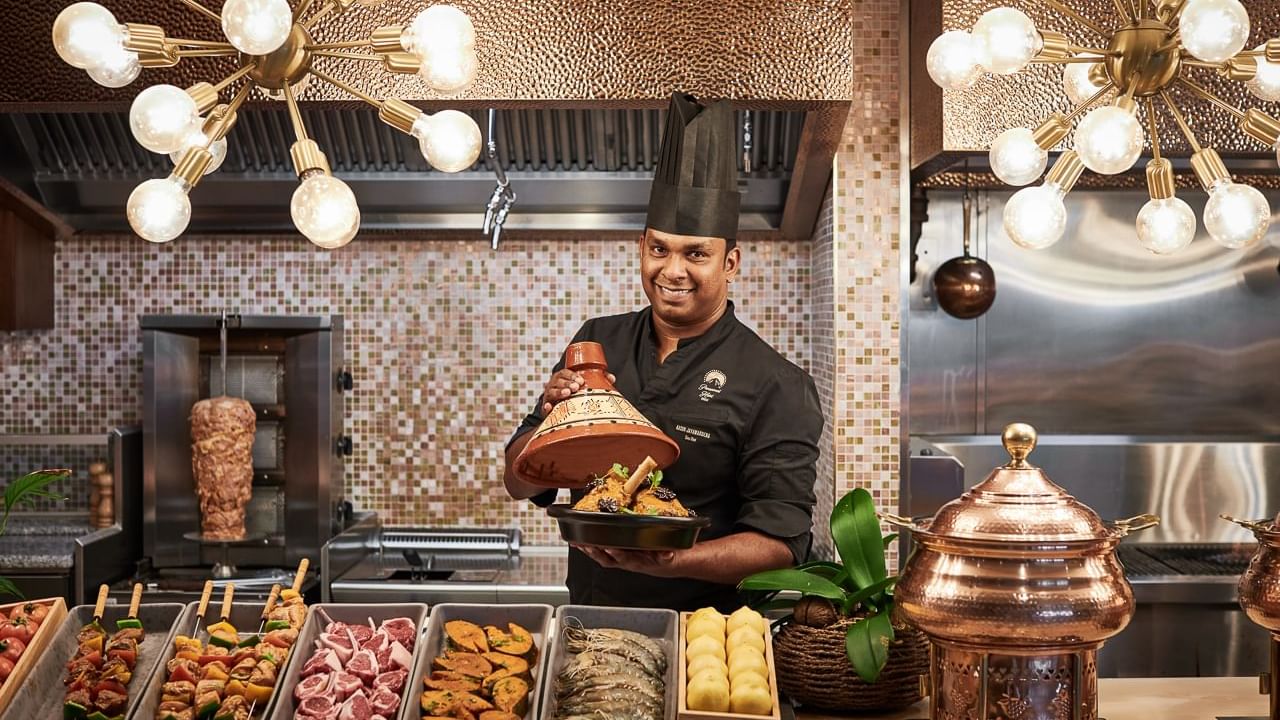 Chef presenting dishes made for Ramadan in The Stage Restaurant at Paramount Hotel Dubai