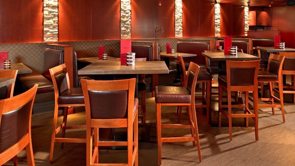 High top tables and booths at restaurant