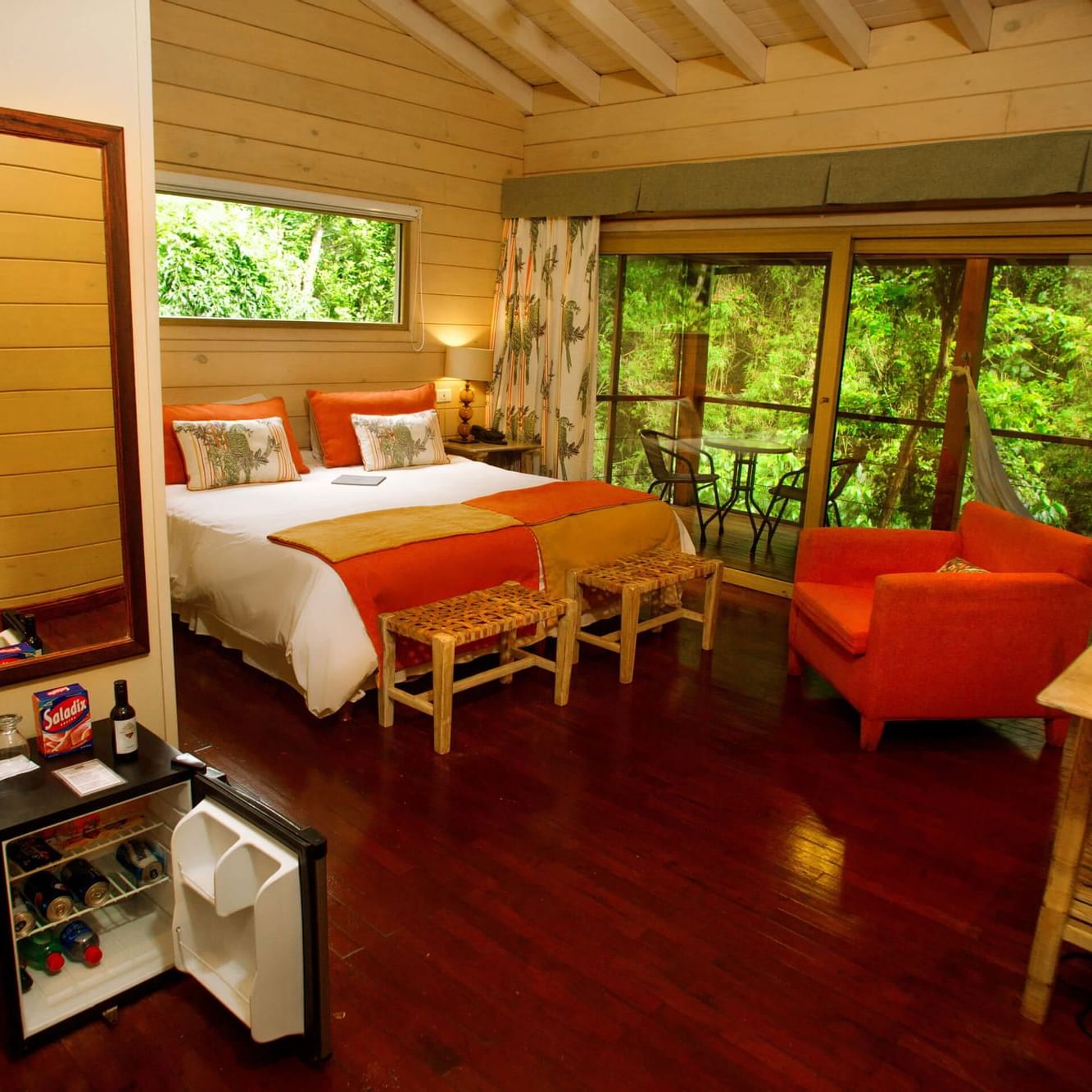 Bedroom & balcony lounge area in Jungle Room at DOT Hotels
