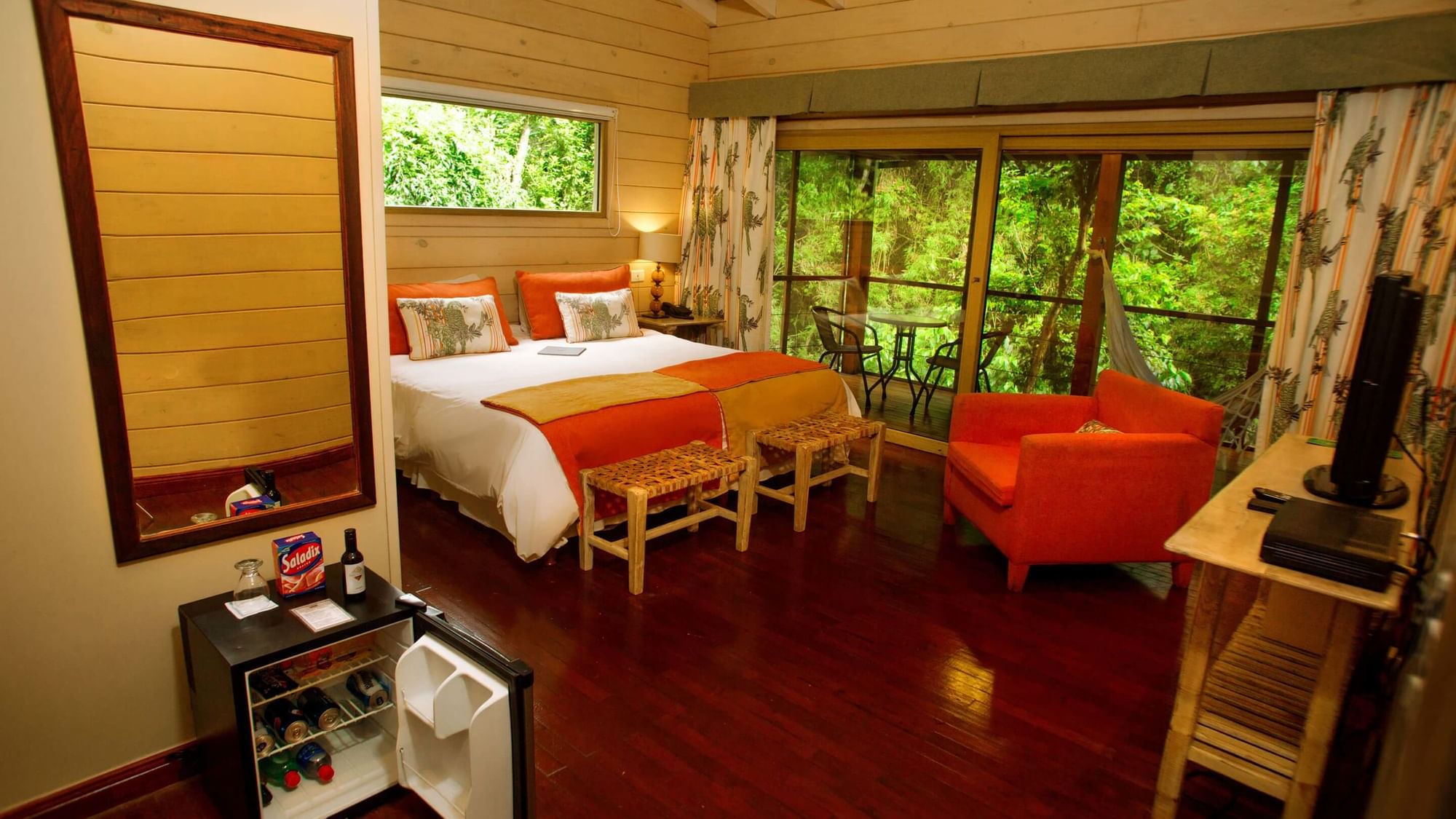 Bedroom & balcony lounge area in Jungle Room at DOT Hotels