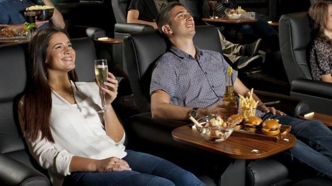 Couple watching movie in theatre near Pullman & Mercure Brisbane King George Square