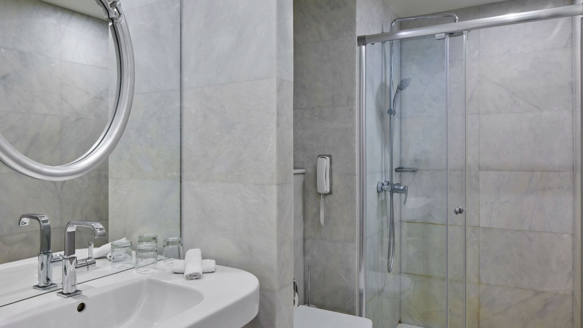 Bathroom with vanity & shower area in Superior Room at Titanic Gendarmenmarkt