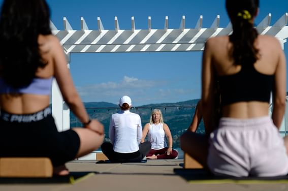 Women doing yoga on the deck at Hotel Eldorado