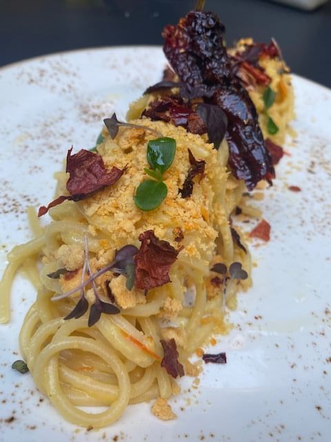 A Carbonara dish served on a plate at Rome Luxury Suites