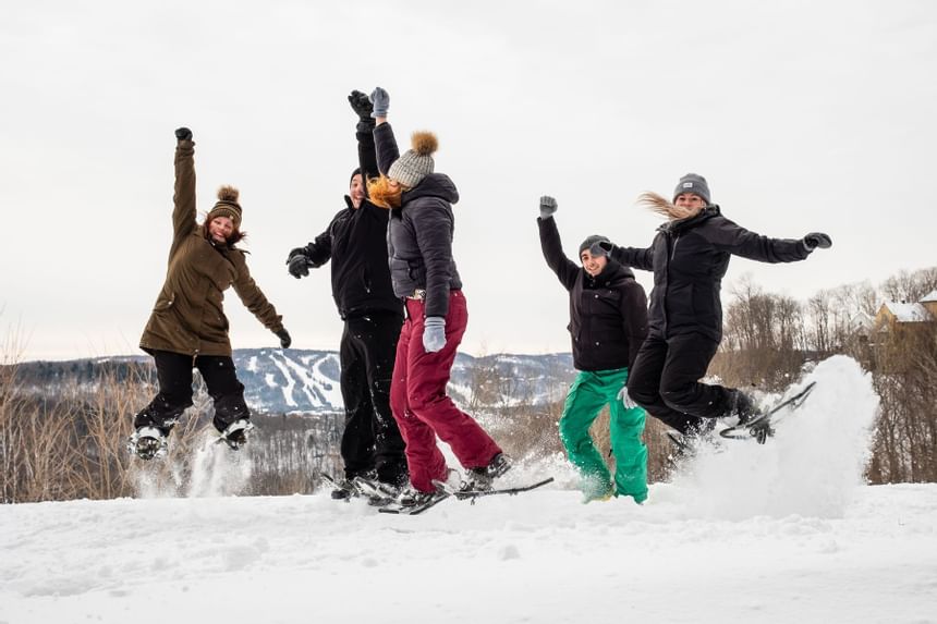 Family having fun skiing at Mont Gabriel Resort & Spa