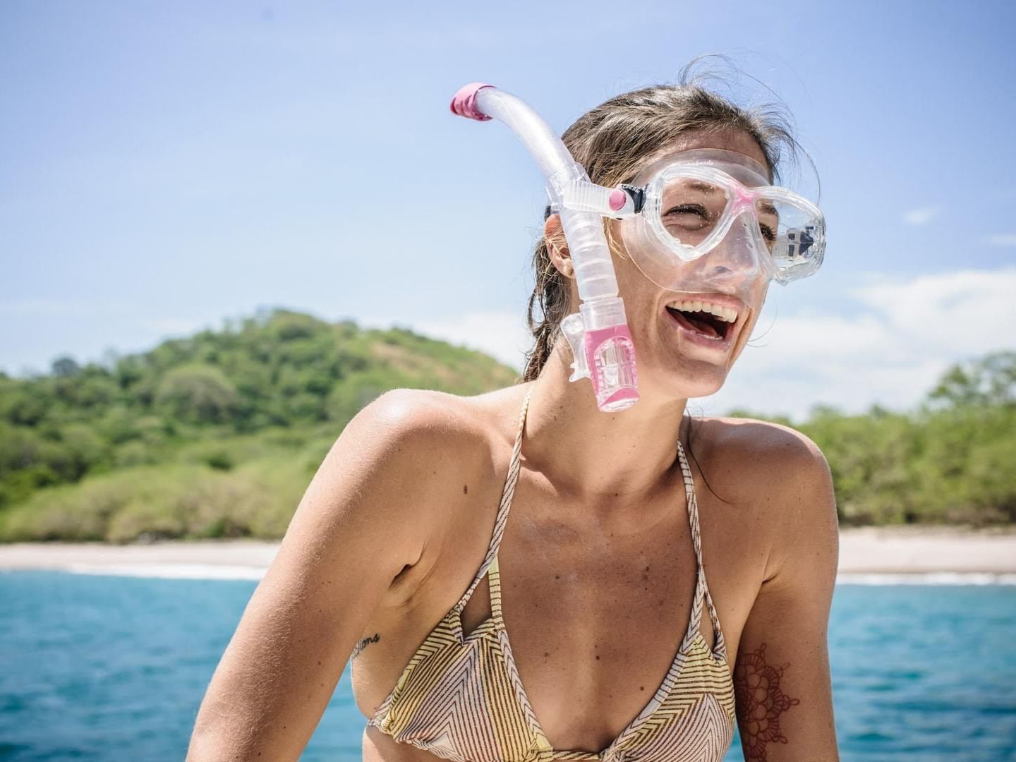 Woman getting ready for Snorkeling at Cala Luna Boutique Hotel