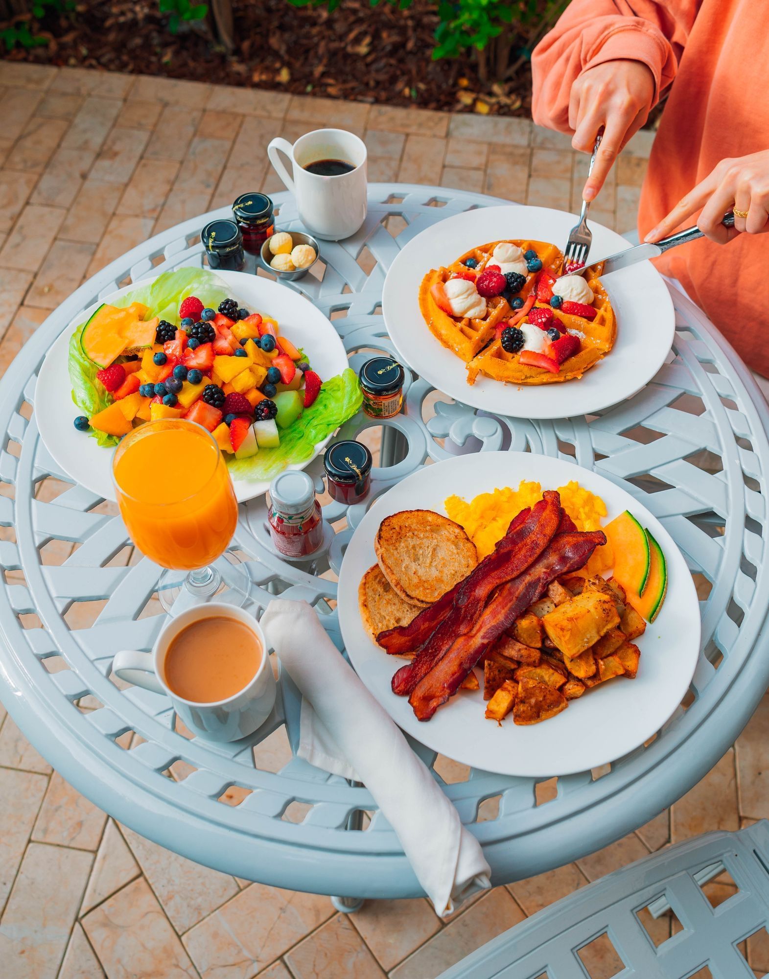 Lorem ipsum Breakfast spread with fruits, waffle, bacon, orange juice and coffee