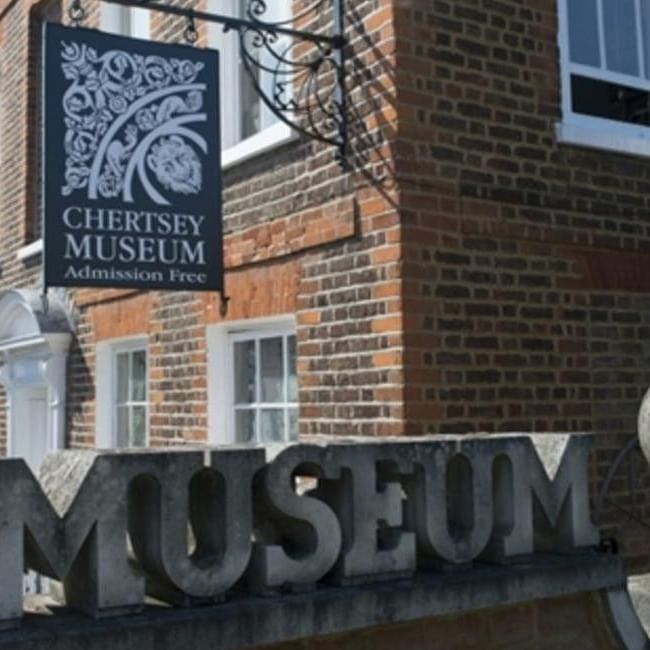 Chertsey Museum sign and building facade showing admission is free.