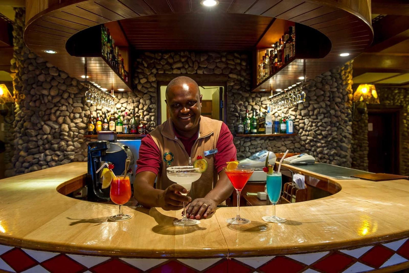 A bartender serving fresh cocktails at Ngorongoro Serena