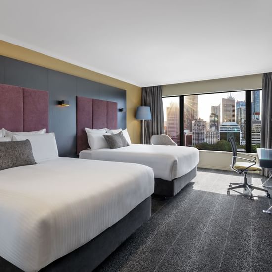 Cozy beds arranged in Executive Suite at Pullman Sydney Hyde Park