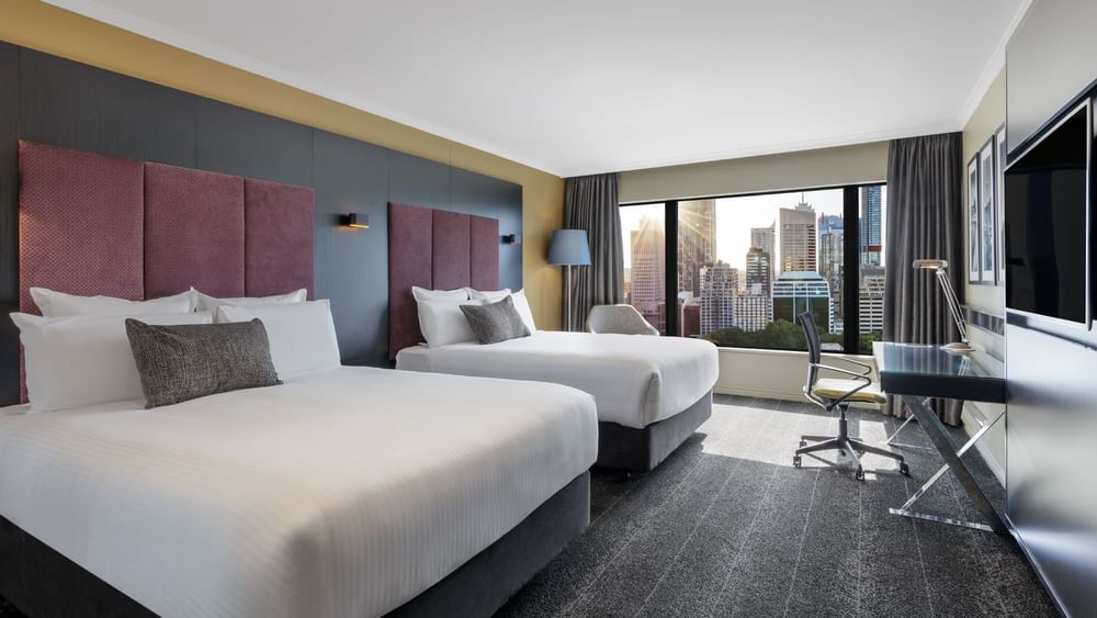 Cozy beds arranged in Executive Suite at Pullman Sydney Hyde Park