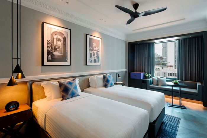 Sitting area & nightstands by the cozy beds in Crystal Club Premier Room at Grand Park City Hall