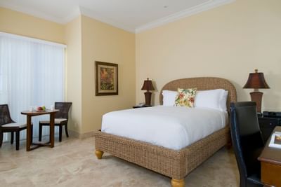 Comfy bed with white beddings in Studio room at Windsong Resort On The Reef