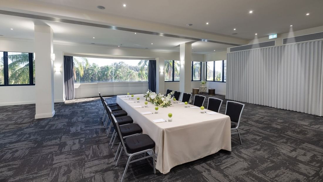 Elegant event room with a long table setup at Mercure Gold Coast Resort in Carrara.