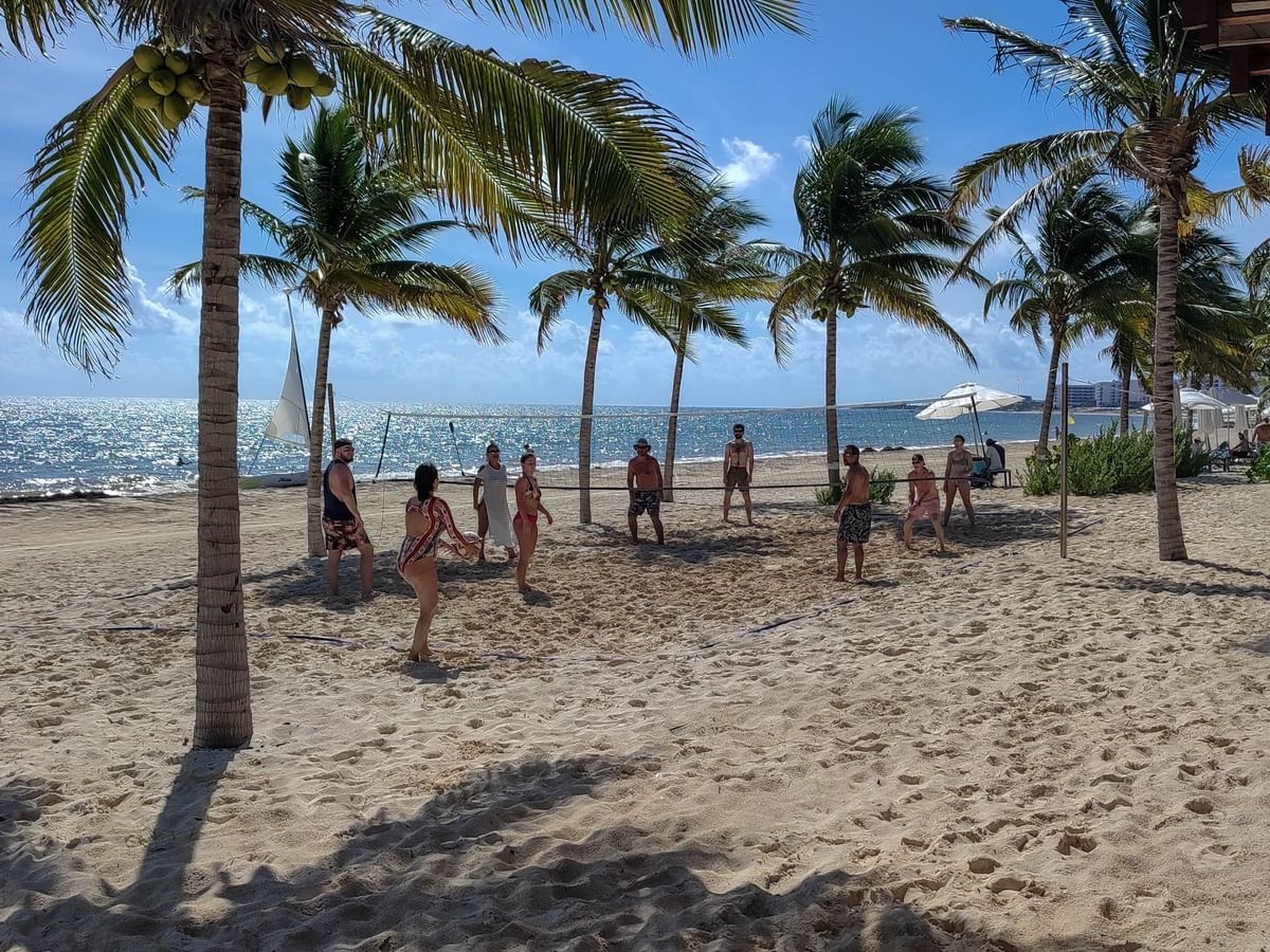 Group playing volley ball on the beach at Haven Riviera Cancun