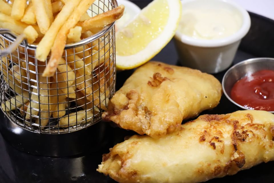 Fish chips served with fries in Harbour City at Hotel Halifax