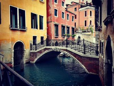 A bridge in scenic canal in Venice near Hotel Bisanzio