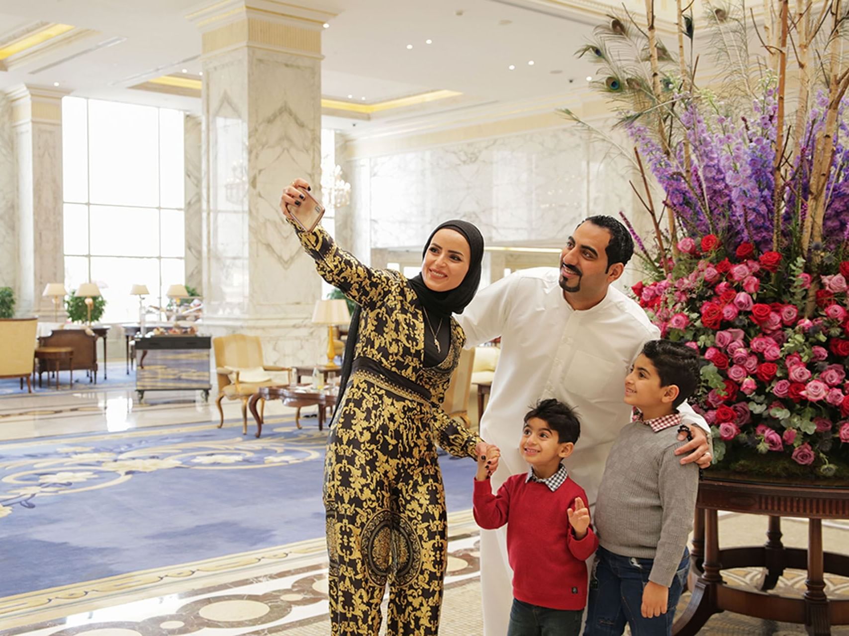 Family taking a selfie at the lobby of The Regency Hotel