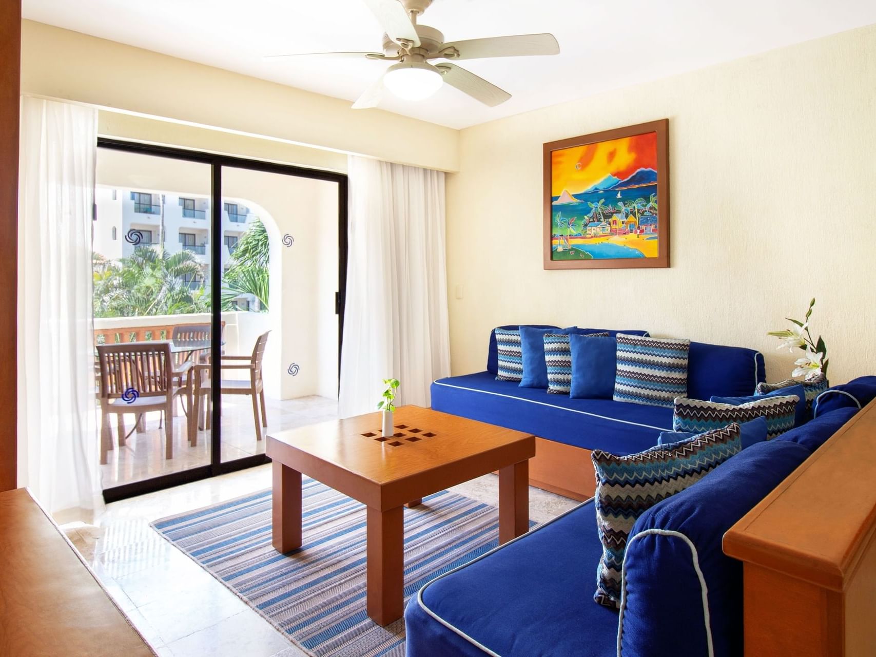 Living area in 2 Bedroom Family Suite, Pool View at Plaza Pelicanos Grand Beach Resort