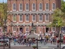 People crowded outside at Faneuil Hall near The Eliot Hotel