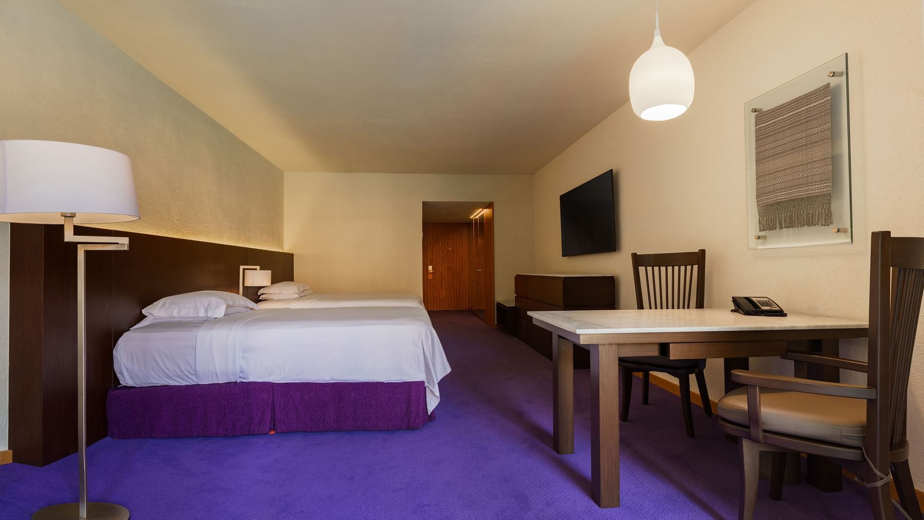 2 Double Superior Deluxe Garden View including a marble table, purple floor, and simple decor at Camino Real Polanco Mexico