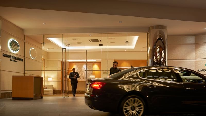Concierge team opening car doors for guests at Sunway Putra Hotel