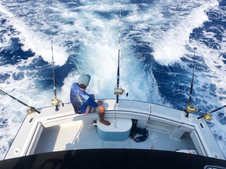 A man sailing for deep-sea fishing near Infinity Bay Resort