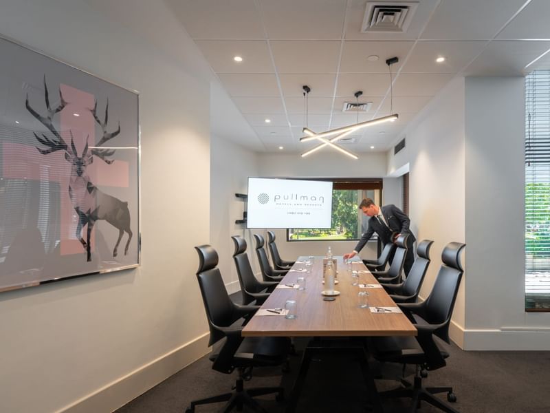 Boardroom set-up with TV in Frazer Room at Pullman Sydney Hyde Park
