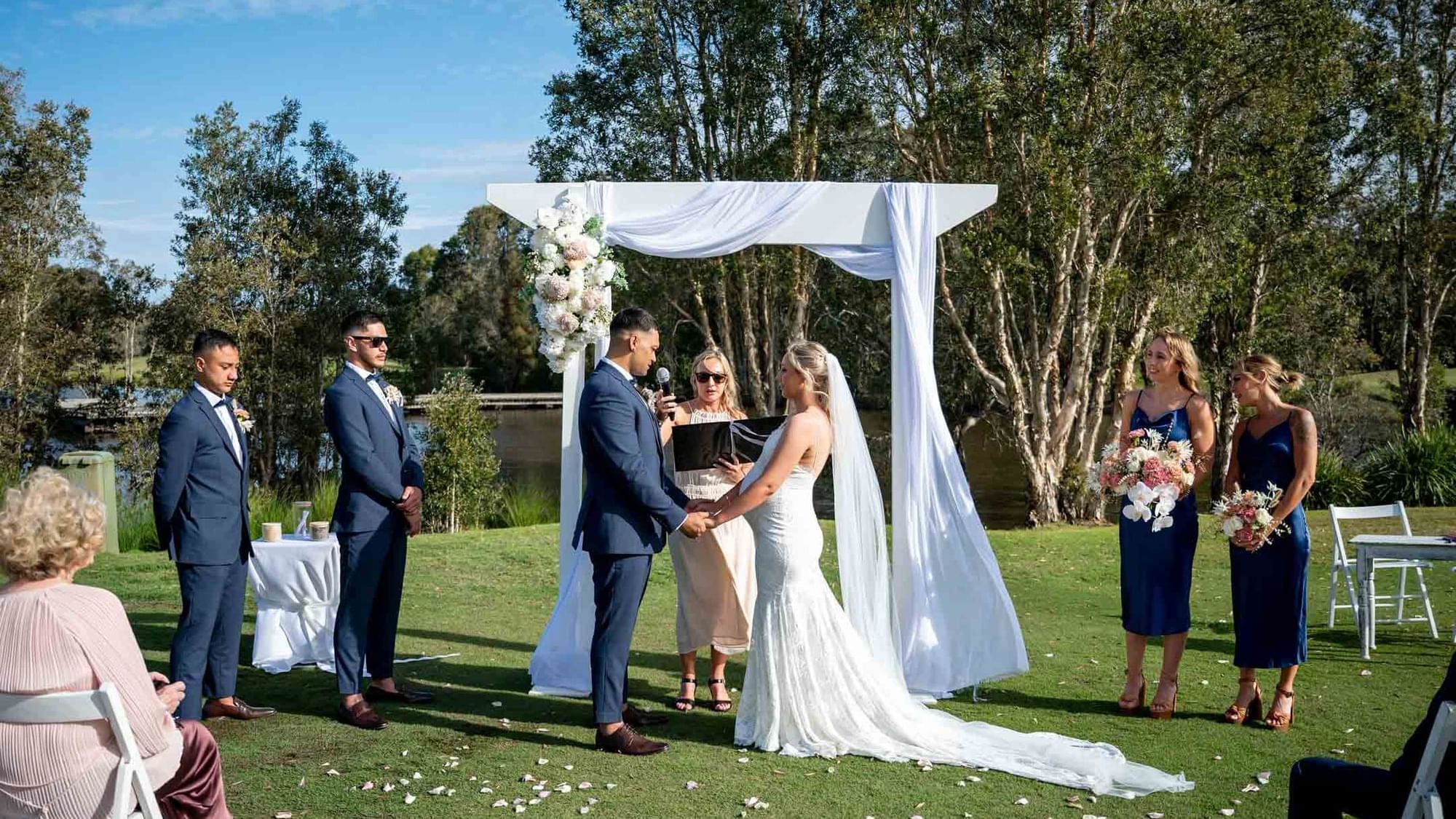Outdoor wedding ceremony with a couple at the altar near Mercure Kooindah Waters