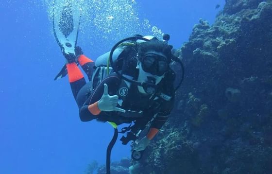 A guest enjoying a Key Largo Dive Center's scuba diving adventure.