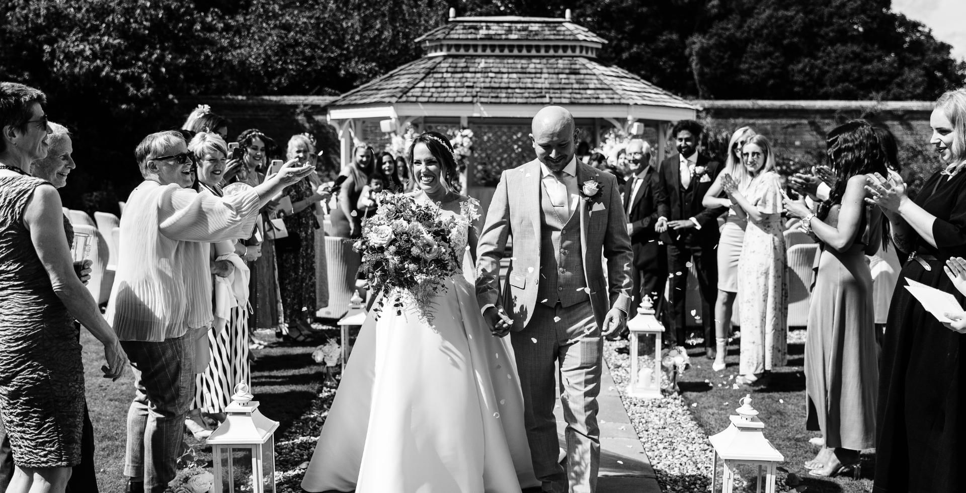 Bride and Groom getting married in at Easthampstead Park, a fantastic outdoor wedding venue in Berkshire