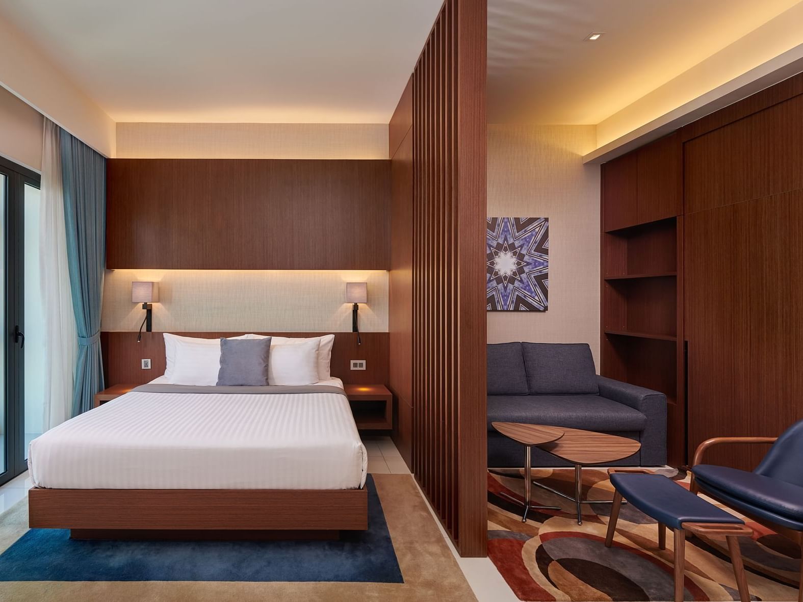 Bedroom & lounge area in Studio Suite at Federal Hotels