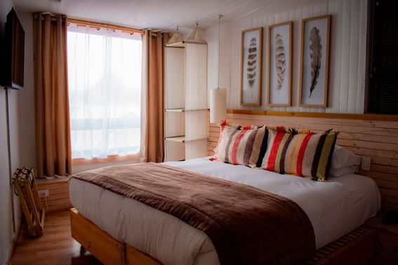 Deluxe Room bedroom with kingbed at NOI Indigo Patagonia