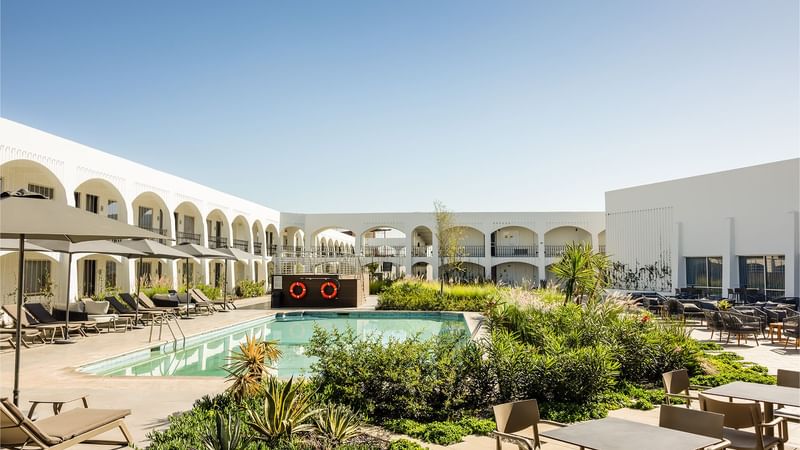 Sunbeds by the outdoor swimming pool at Gamma Ciudad Juarez