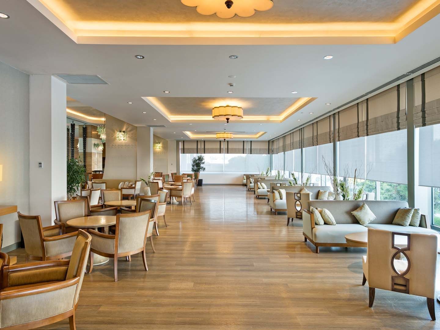 Interior of spacious dining area with cozy loungers in Cordelia Lobby Bar at Titanic Deluxe Lara