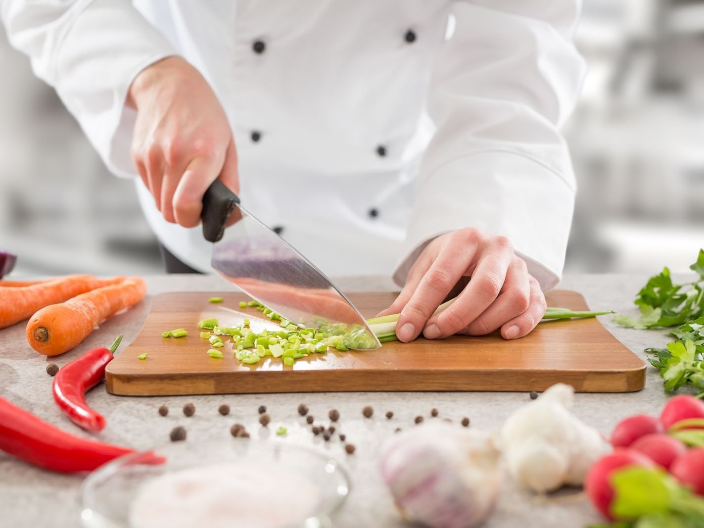 A chef cooking at a Dinner Show near Mystic Dunes Resort