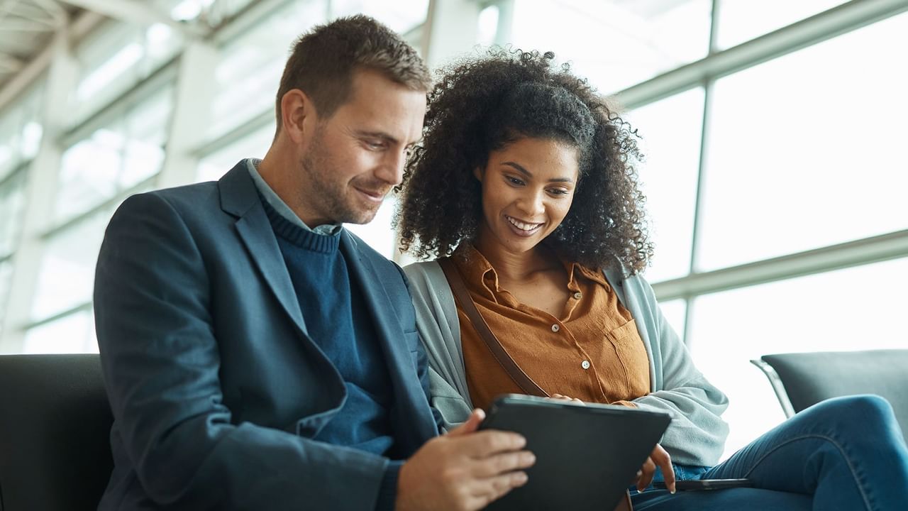 Two people inside an airport