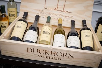 Box of Duckhorn wine bottles showcasing a variety of flavors neatly packed at The Stanley Hotel