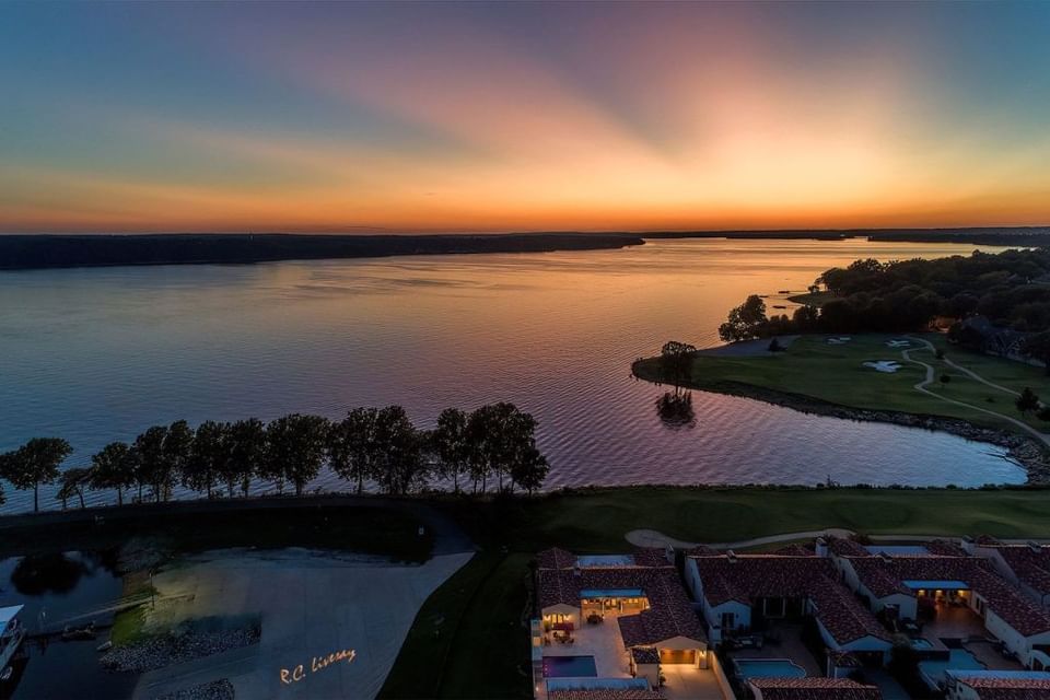 Distant view of the hotel & lake at sunset in Shangri-La Monkey Island