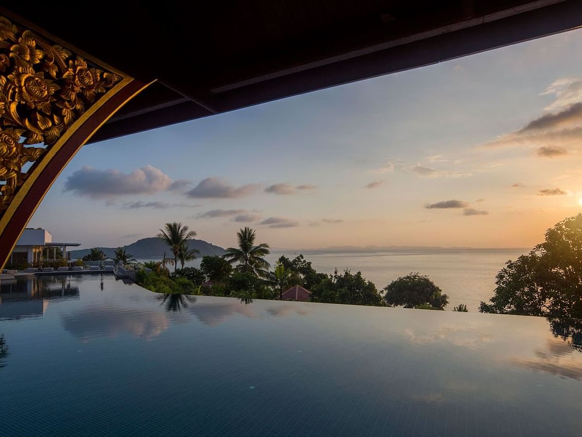 Sunset view from the pool terrace at Amatara Wellness Resort