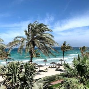The exterior view of the beach coast at Ajman Hotel