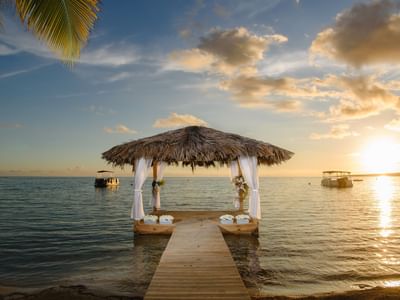 Ocean front wedding setup at Copa Marina Weddings at sunset