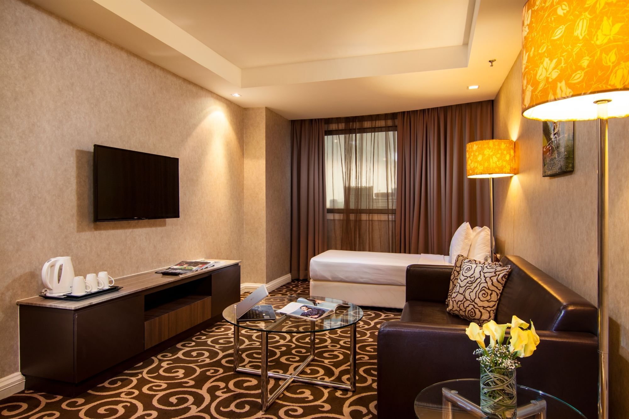 Living area with Sofa & a TV in Classic Suite at Sunway Putra Hotel