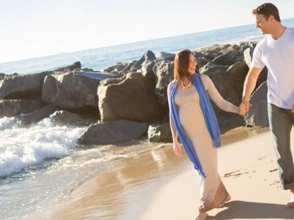 Couple walking in the beach near the Pullman Bunker Bay Resort